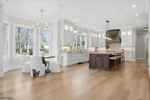 a very nice looking dining room with a table and chairs