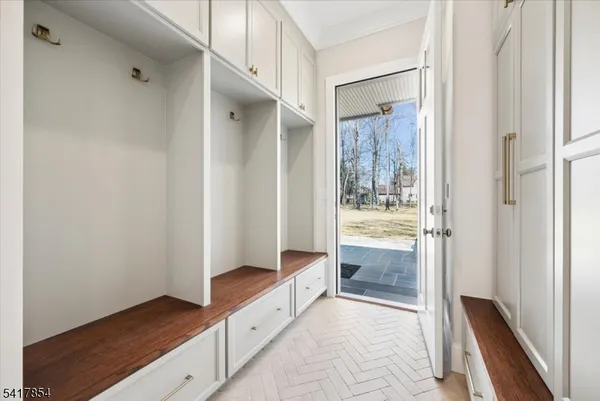 a bathroom with a shower and closet