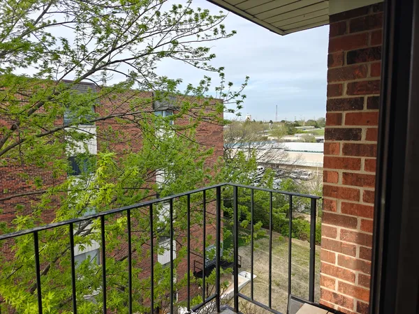 a view of a balcony with an outdoor space