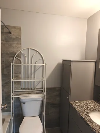 a bathroom with a toilet and a sink
