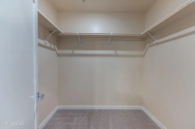 a view of an empty walk in closet