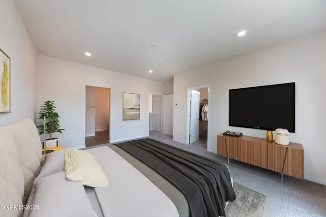 a bedroom with bed and tv