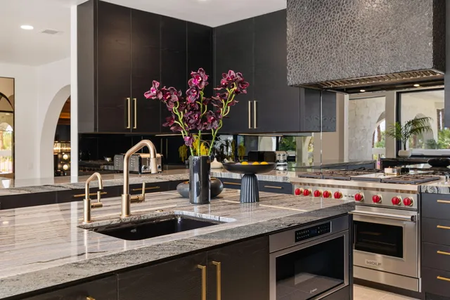 a view of a porch with a table and chairs