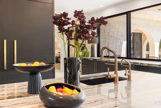 a dining room with furniture a flat screen tv and a large window