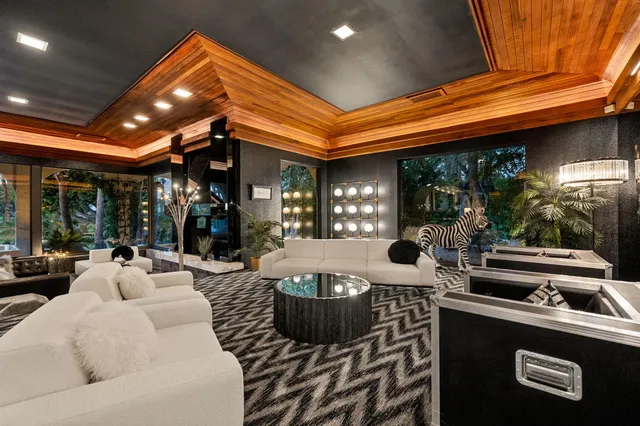 a living room with fireplace furniture and a flat screen tv