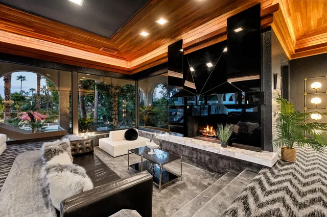 a spacious bedroom with a large bed and a couch