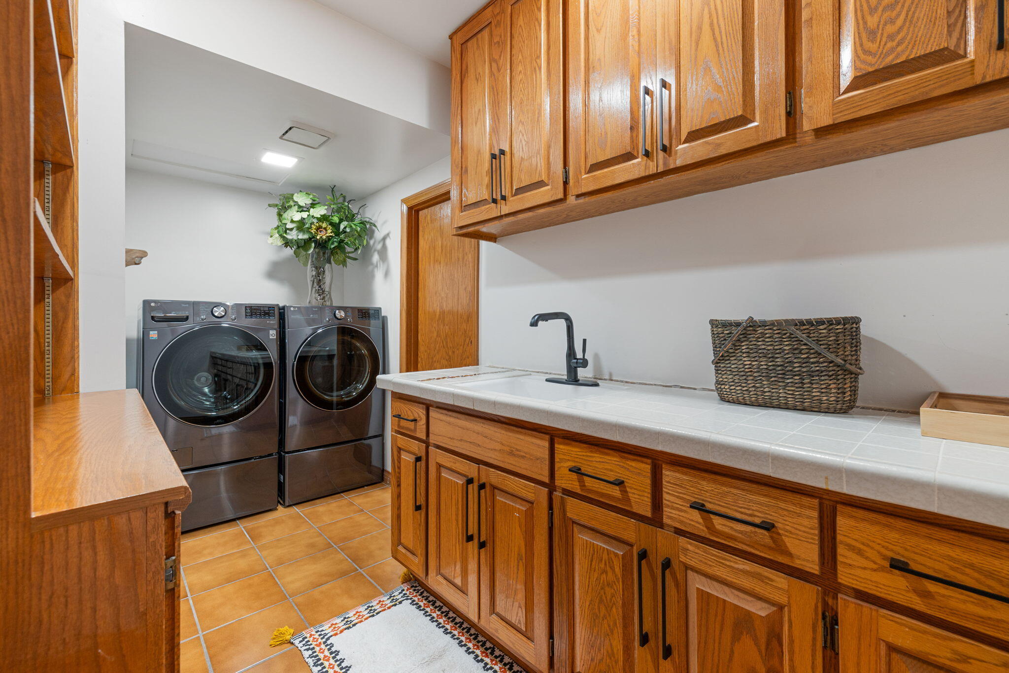 70663 Oroville Circle Rancho Mirage, CA 92270 - Photo 32 of 47 a kitchen with stainless steel appliances granite countertop a sink a washer and dryer