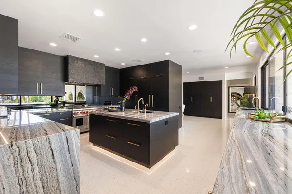 a spacious bedroom with a large bed and a couch