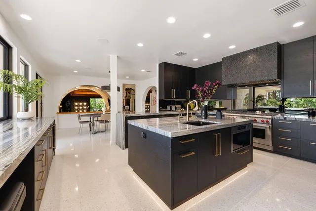a kitchen with a sink stove and cabinets