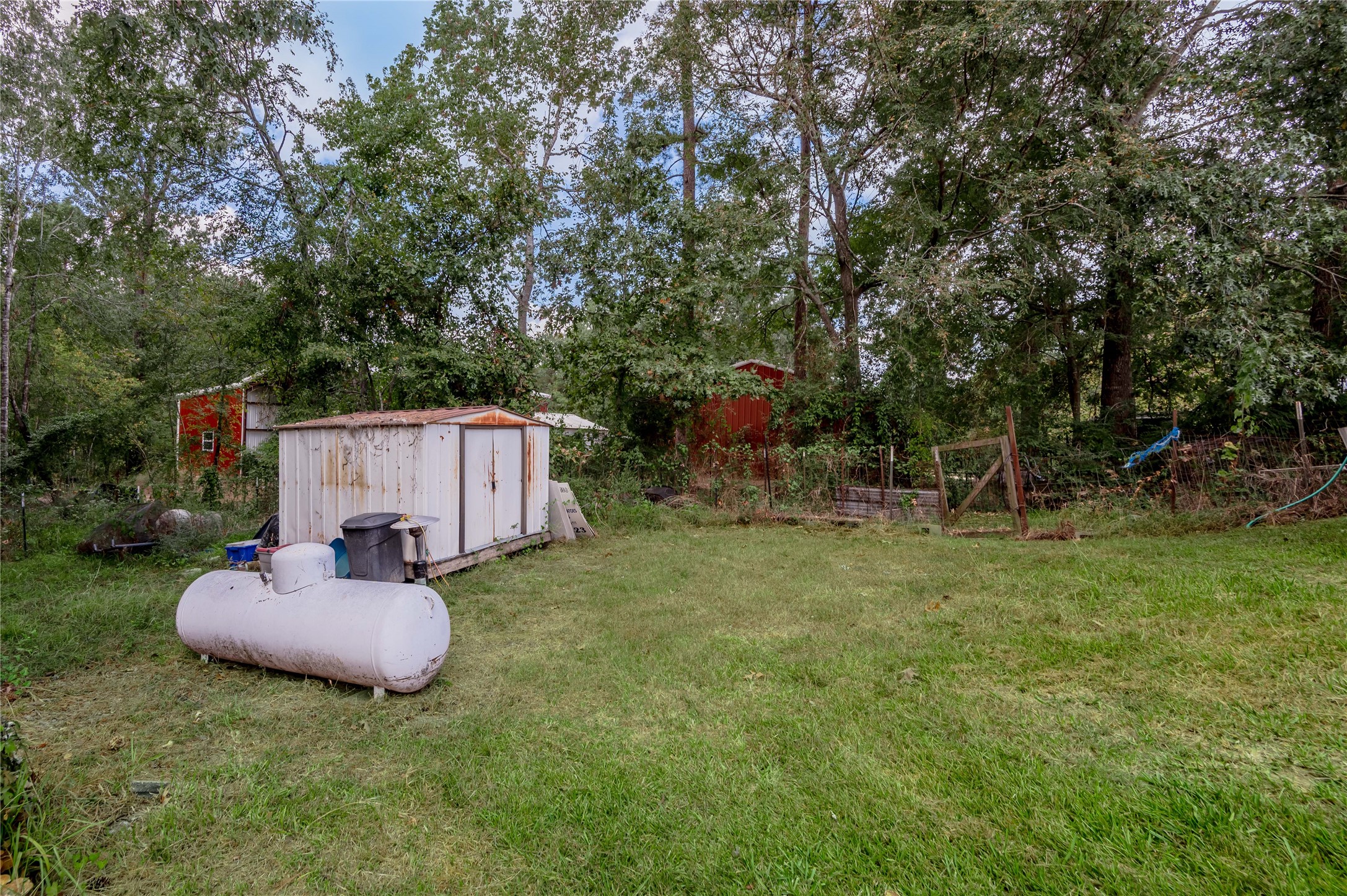47-57 Stage Coach Road Coldspring, TX 77331 - Photo 29 of 50 a backyard of a house with table and chairs