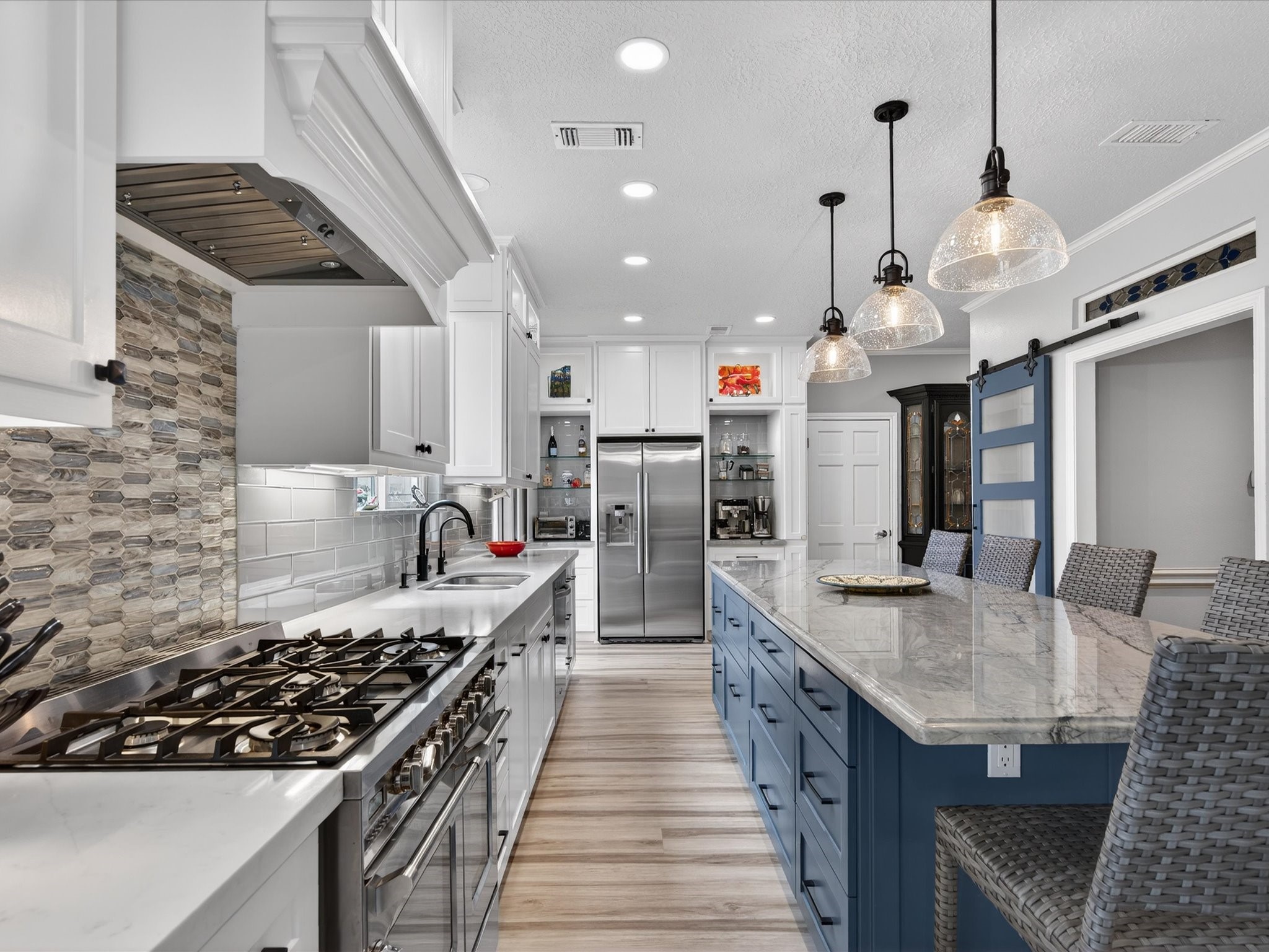 6207 Sandypine Drive Spring, TX 77379 - Photo 13 of 46 Thoughtfully designed with upgraded stainless steel appliances, an impressive gas range, and convenient pots-and-pans drawers—every detail was considered in this 2020 renovation.