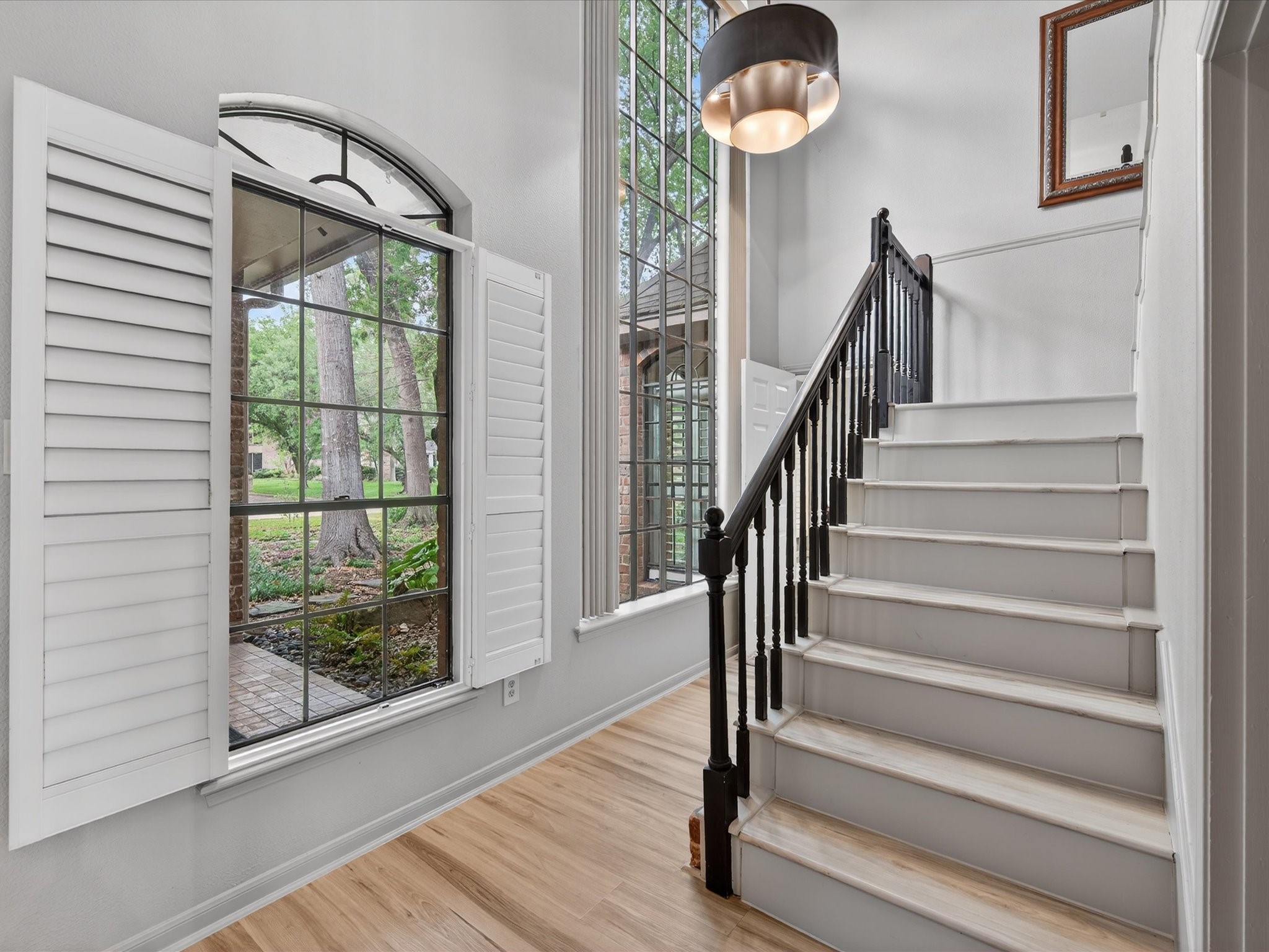 6207 Sandypine Drive Spring, TX 77379 - Photo 19 of 46 Natural light pours through large windows—many updated to double-pane (2015)—creating an inviting space you’ll love year-round.