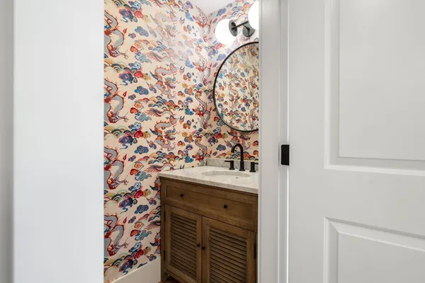 a bathroom with a shower and a sink