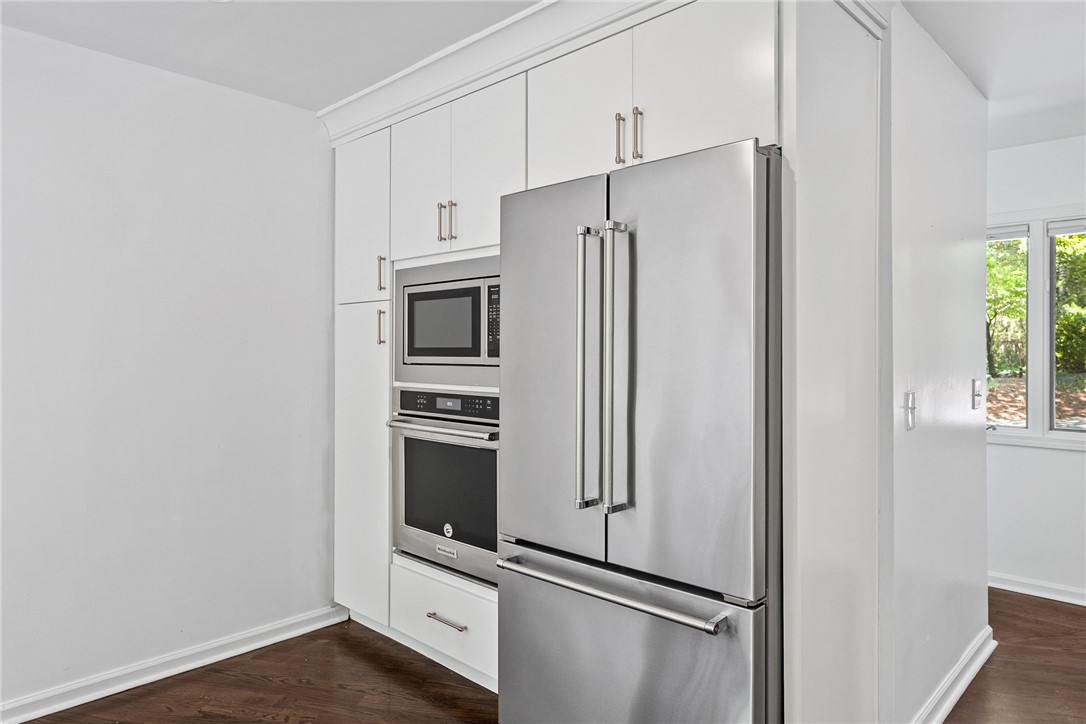 118 Beacon Ridge Circle Salem, SC 29676 - Photo 10 of 45 The kitchen offers high-end stainless steel appliances with clean white cabinetry and dark hardwood flooring.