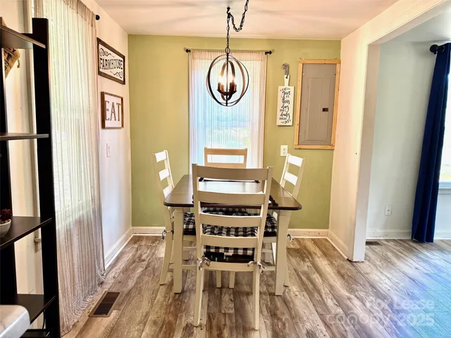 a view of dining room and wooden floor