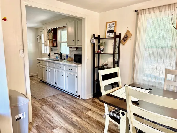 a kitchen with stainless steel appliances cabinets and a window