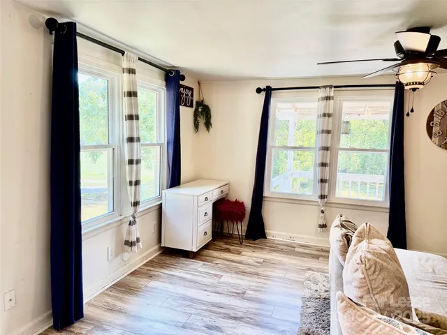 a bed room with a bed and a window