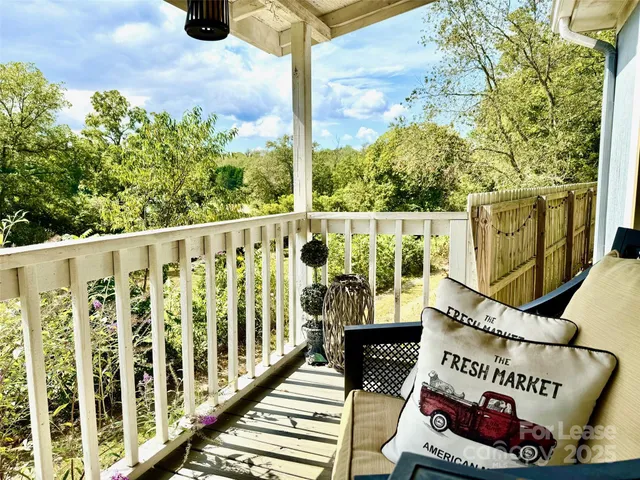 a view of balcony with furniture