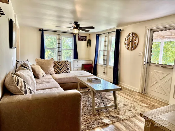 a living room with furniture and a window