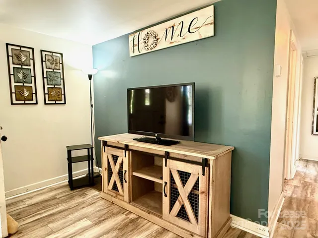 a view of a livingroom with furniture and window