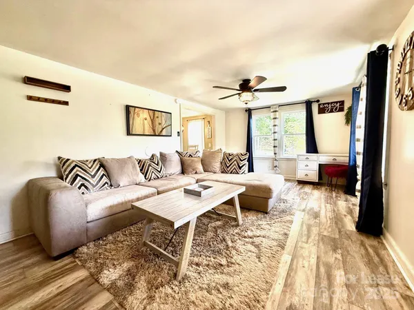 a living room with furniture and a large window