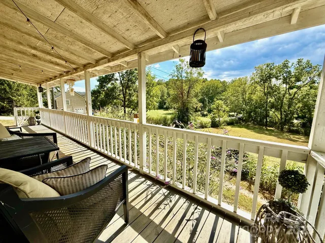 a view of balcony with furniture