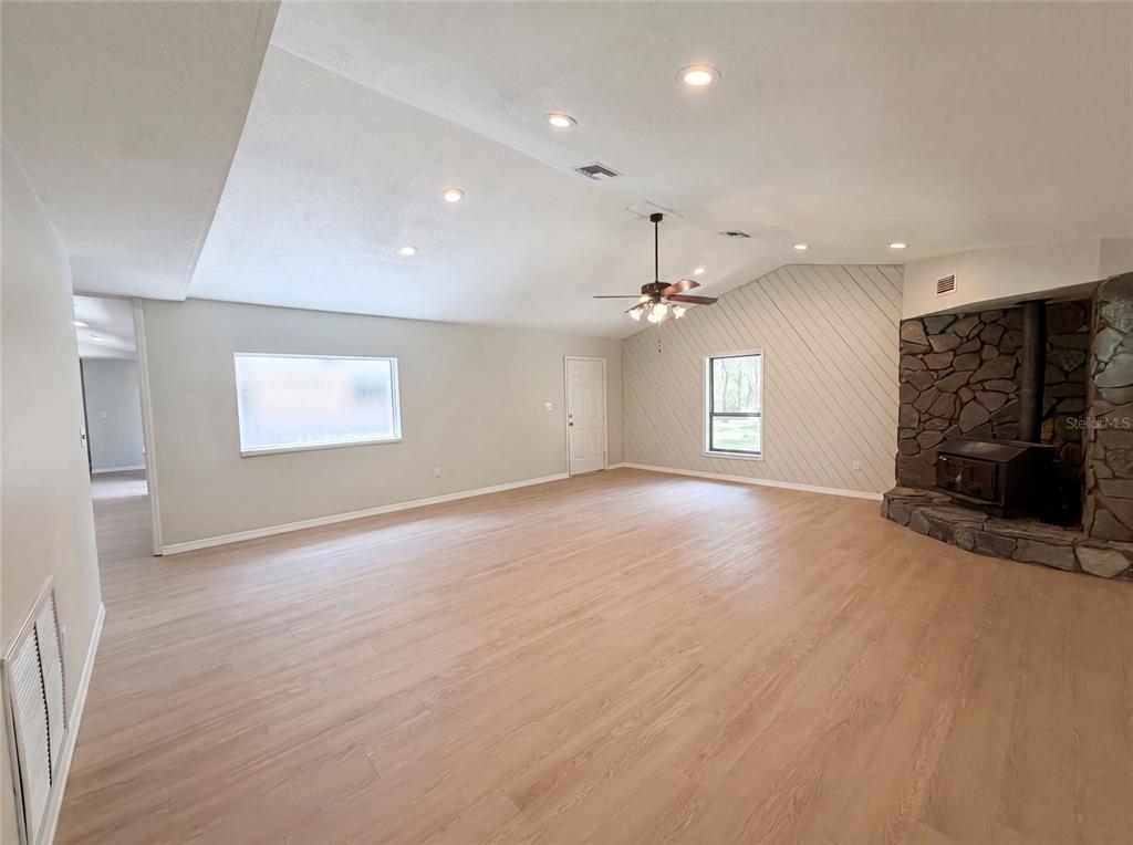 3739 Lake Griffin Road Lady Lake, FL 32159 - Photo 6 of 21 an empty room with windows and fireplace