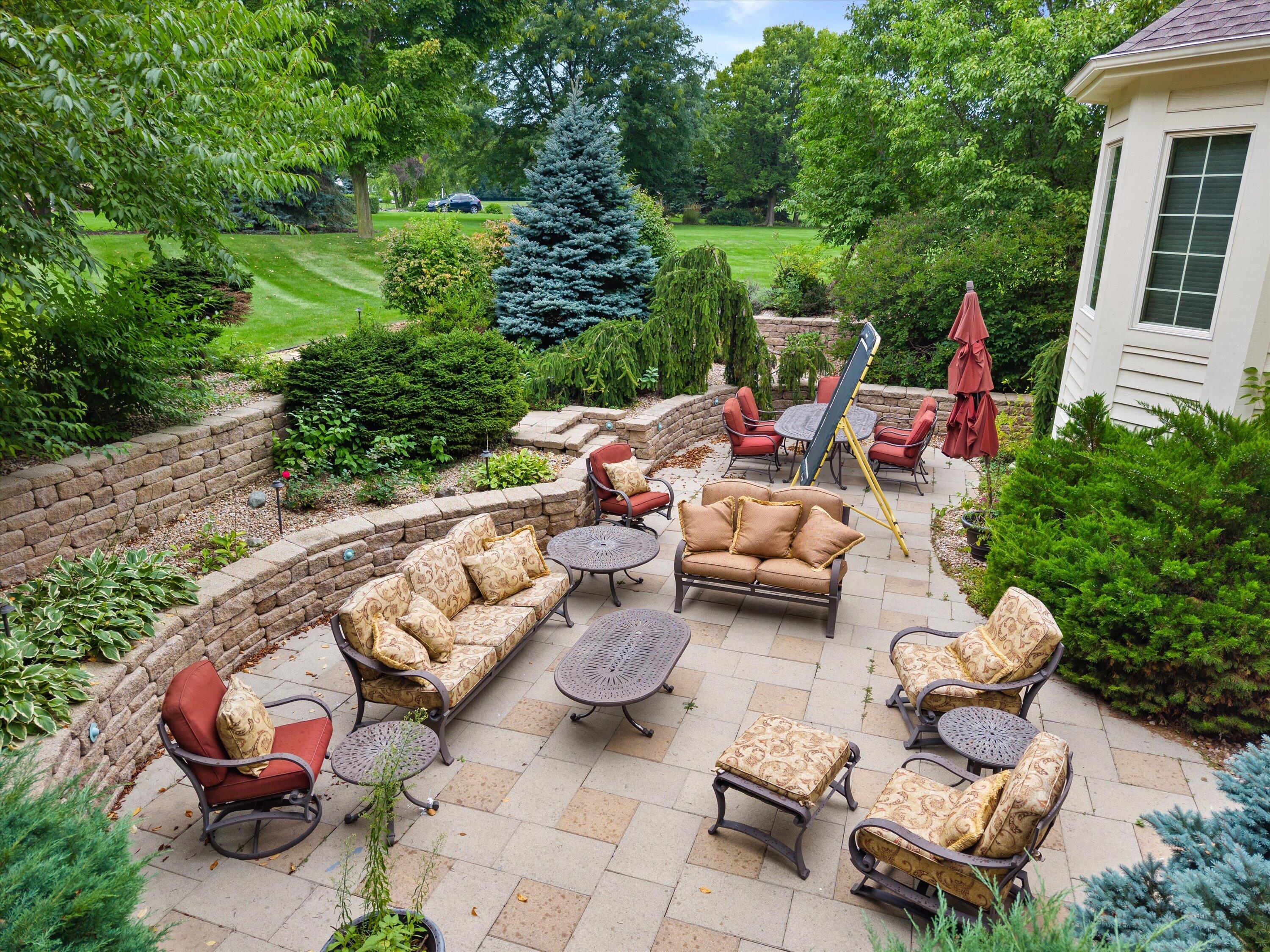 264 Steeple Pointe Circle Delafield, WI 53018 - Photo 66 of 120 The patio adds an additional entertaining area for friends and family.