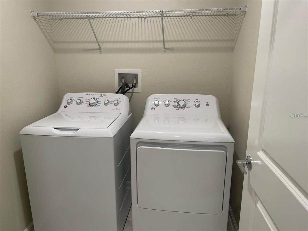 4491 Magnolia Ridge Court Kissimmee, FL 34746 - Photo 16 of 21 a utility room with dryer and washer