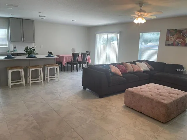 a living room with furniture and a window