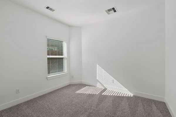 a view of a room that has a window in it