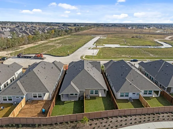 an aerial view of a house with a ocean view