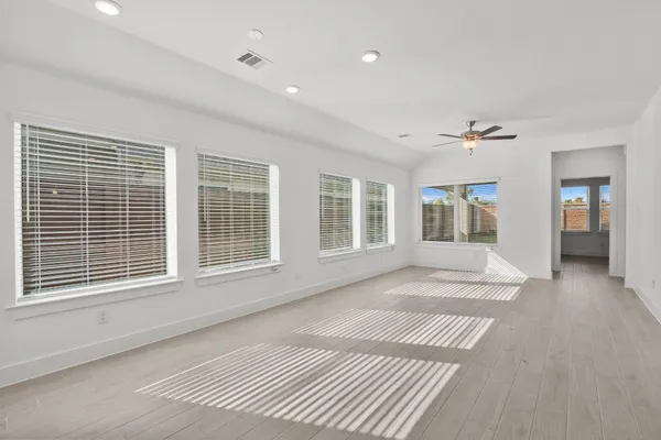 a view of an empty room with a window