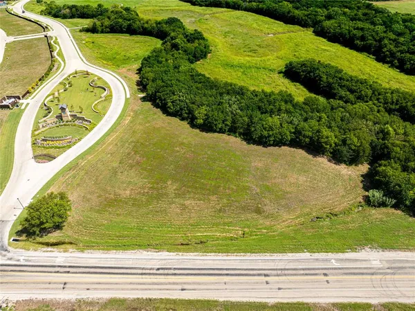 a view of a swimming pool with a yard