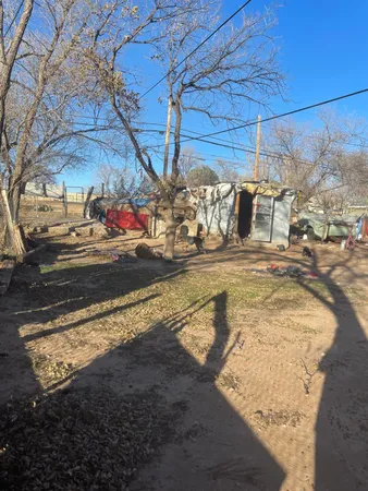 a view of a yard with car parked