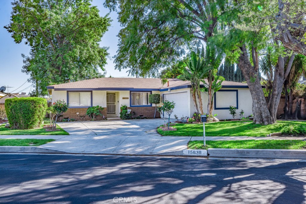 15838 Eccles Street North Hills, CA 91343 - Photo 1 of 38 a front view of a house with plants and garden