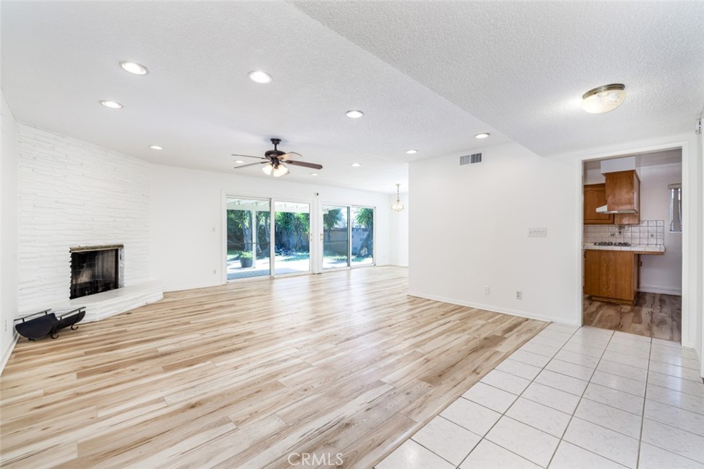 15838 Eccles Street North Hills, CA 91343 - Photo 2 of 38 a view of an empty room with wooden floor and a window