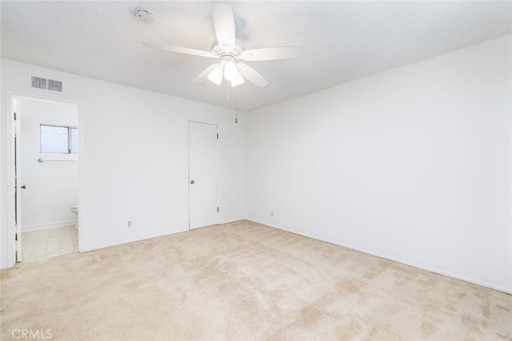 15838 Eccles Street North Hills, CA 91343 - Photo 26 of 38 an empty room with a chandelier fan