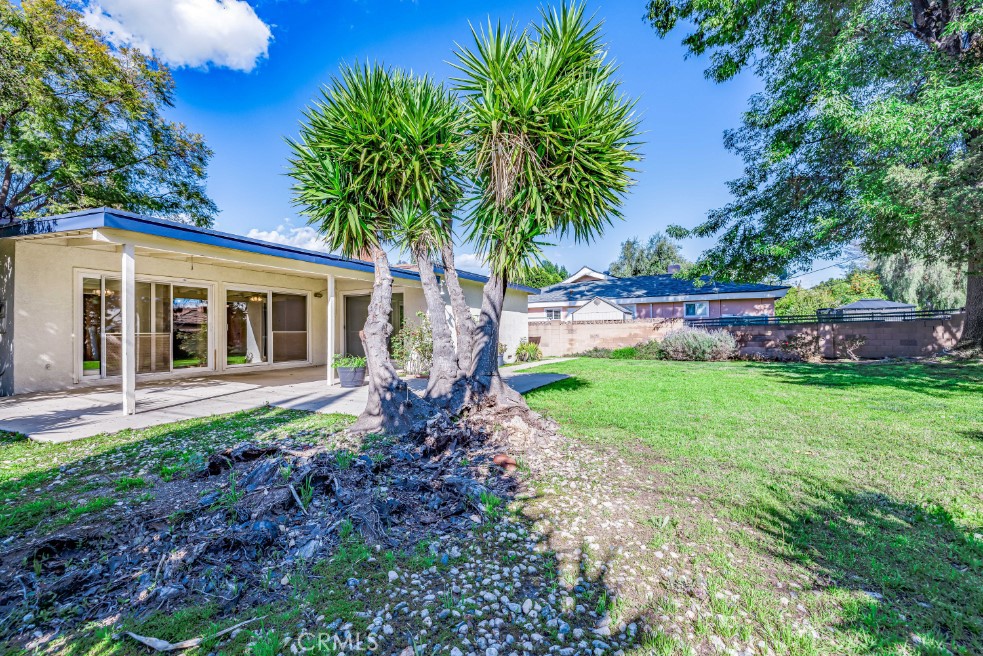 15838 Eccles Street North Hills, CA 91343 - Photo 34 of 38 a front view of a house with garden