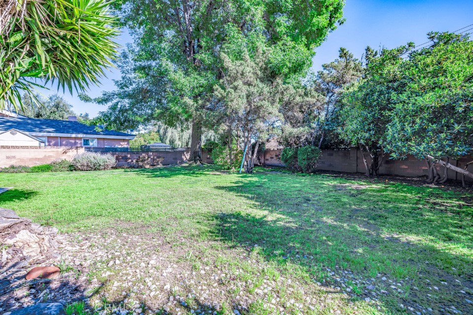 15838 Eccles Street North Hills, CA 91343 - Photo 35 of 38 front view of a house with a yard