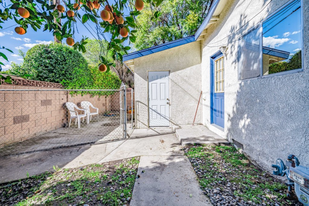 15838 Eccles Street North Hills, CA 91343 - Photo 36 of 38 a view of a chair and table in the backyard