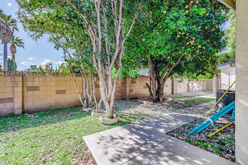 15838 Eccles Street North Hills, CA 91343 - Photo 37 of 38 a view of a backyard with a tree and a lake