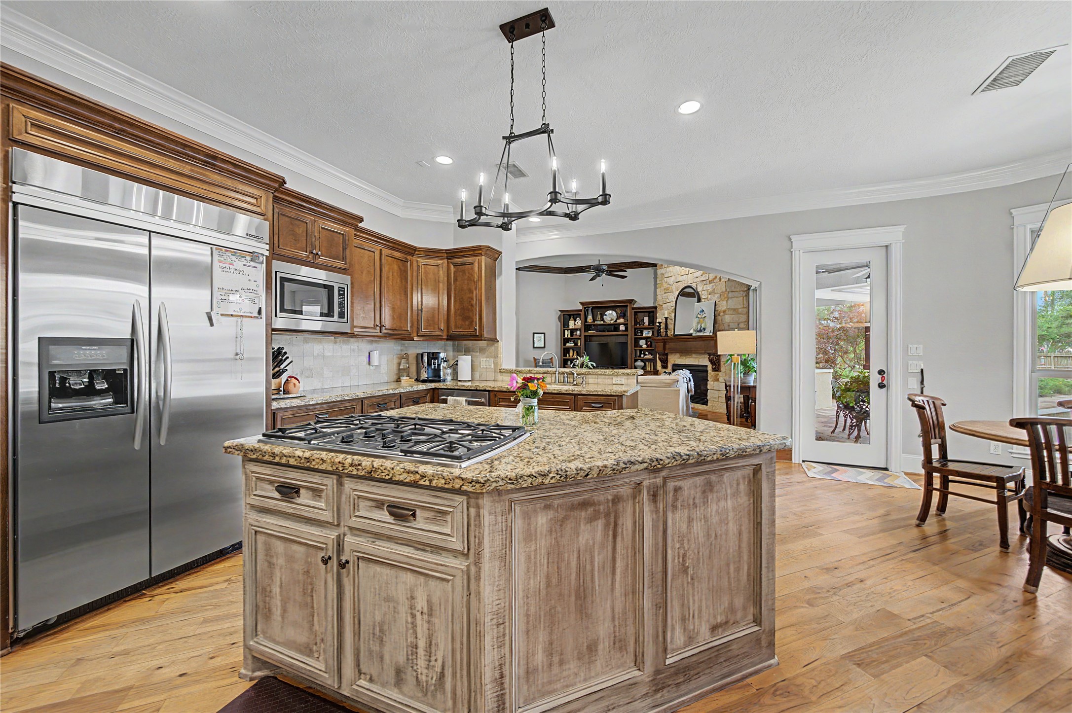 4423 Silver Jade Drive Spring, TX 77386 - Photo 12 of 45 a kitchen with kitchen island a counter top space a sink stainless steel appliances and cabinets