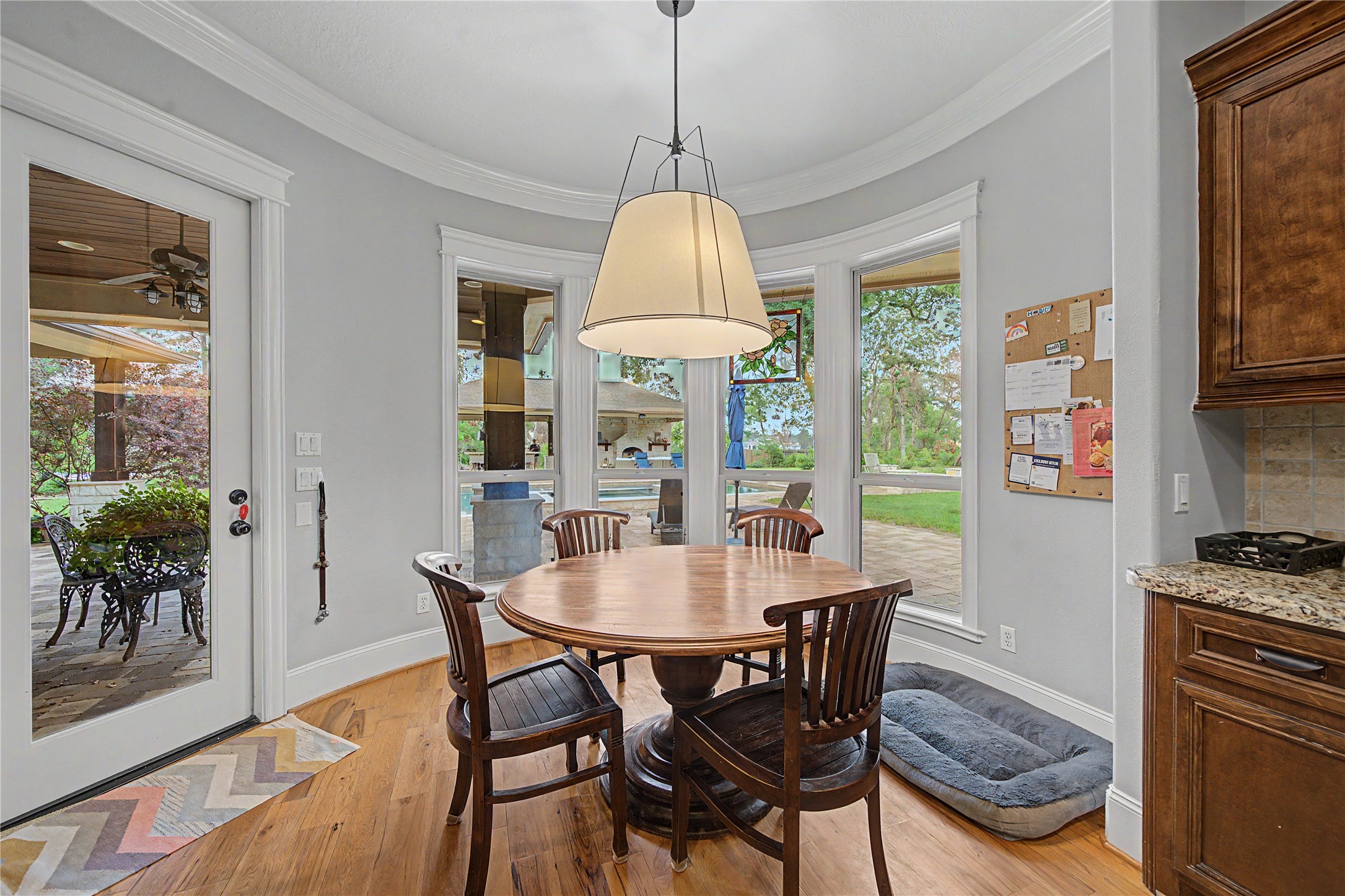 4423 Silver Jade Drive Spring, TX 77386 - Photo 13 of 45 a dining room with furniture a chandelier and wooden floor