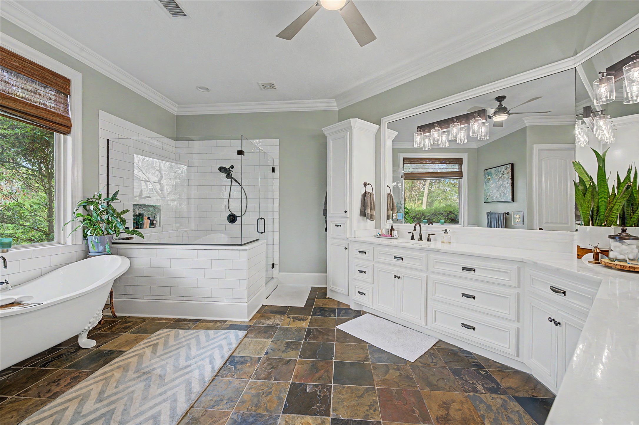 4423 Silver Jade Drive Spring, TX 77386 - Photo 19 of 45 a spacious bathroom with a double vanity sink a large mirror and a bathtub