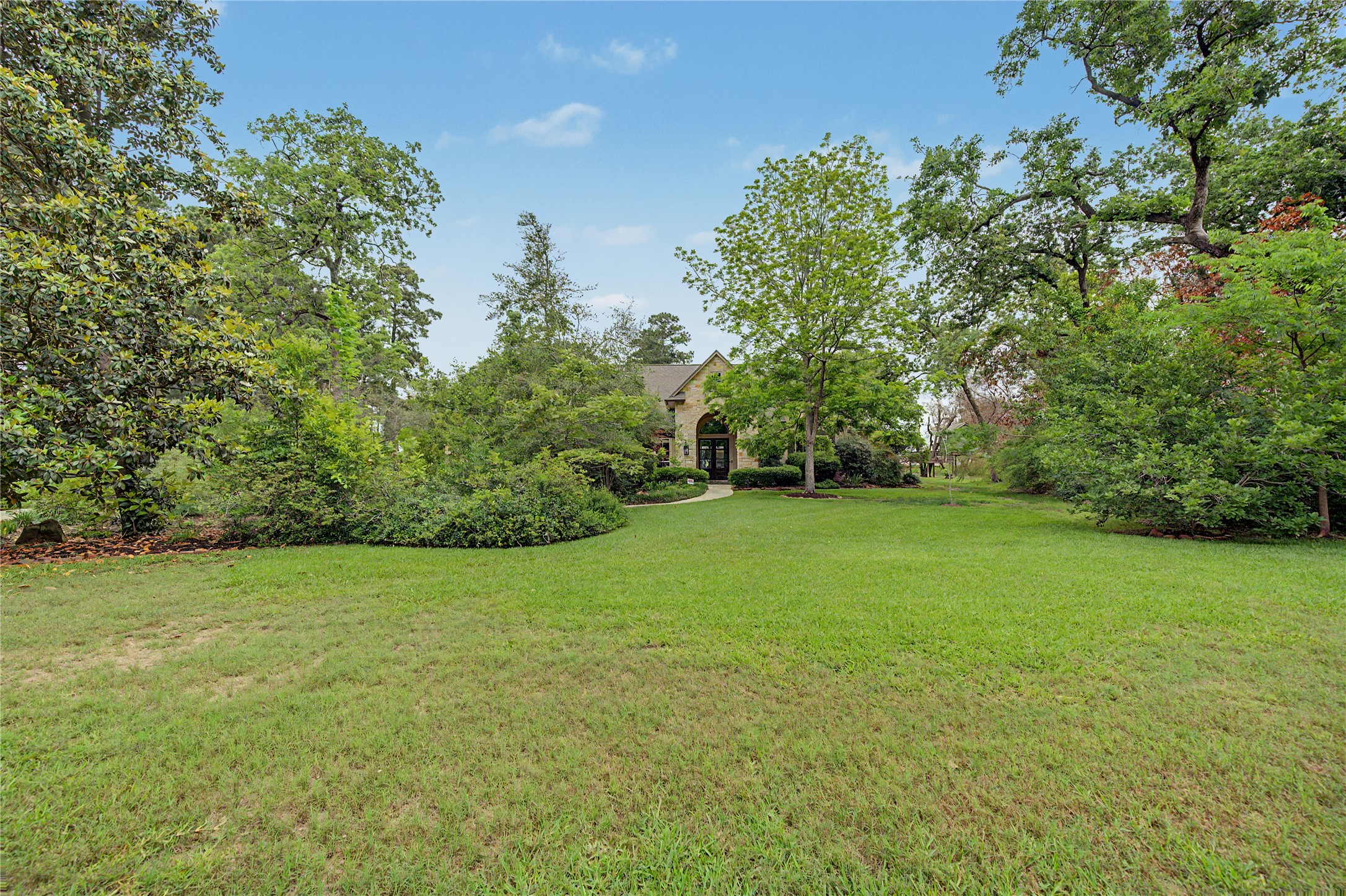 4423 Silver Jade Drive Spring, TX 77386 - Photo 2 of 45 a view of a field of grass and trees