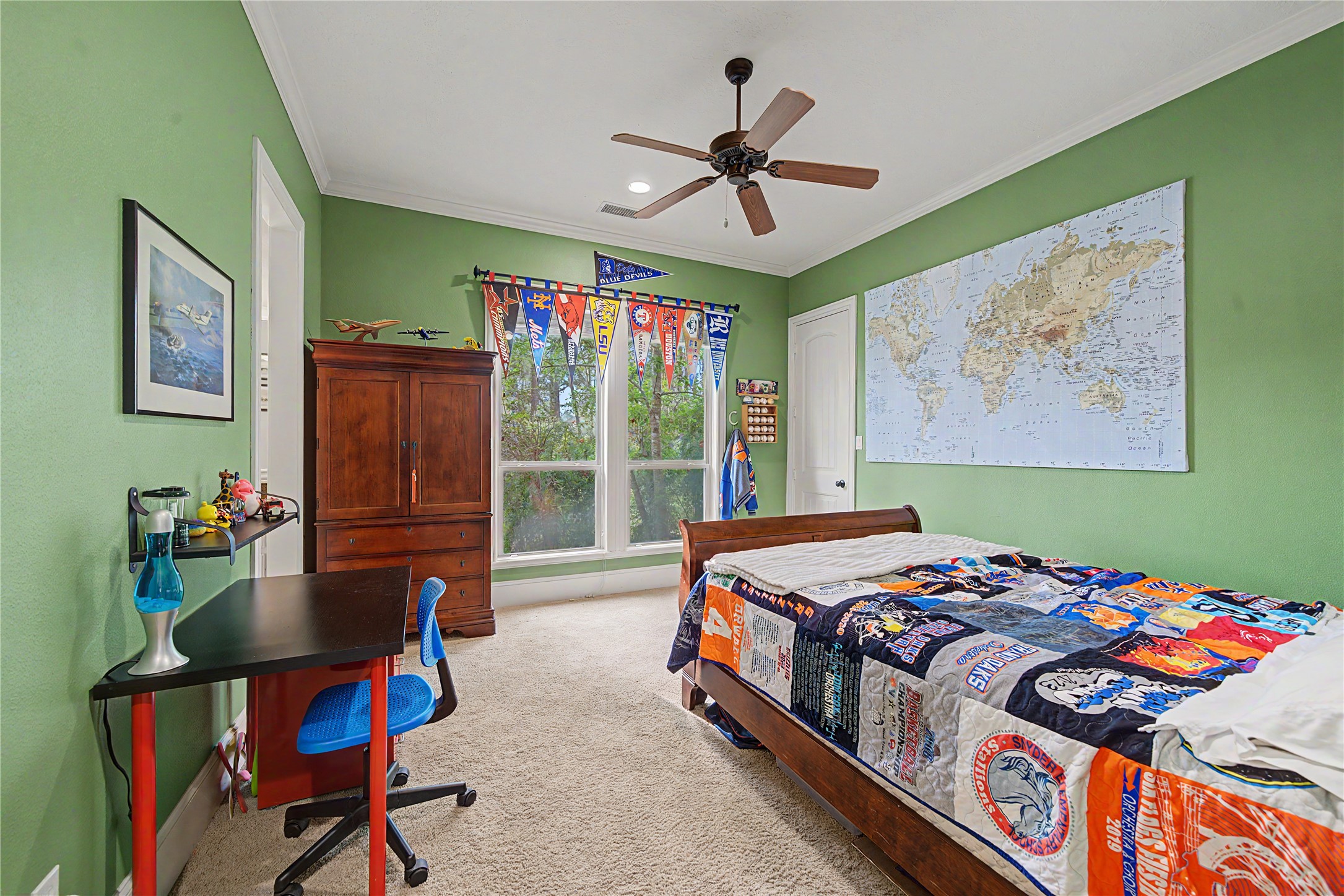 4423 Silver Jade Drive Spring, TX 77386 - Photo 22 of 45 a bedroom with a bed a dresser and a large window