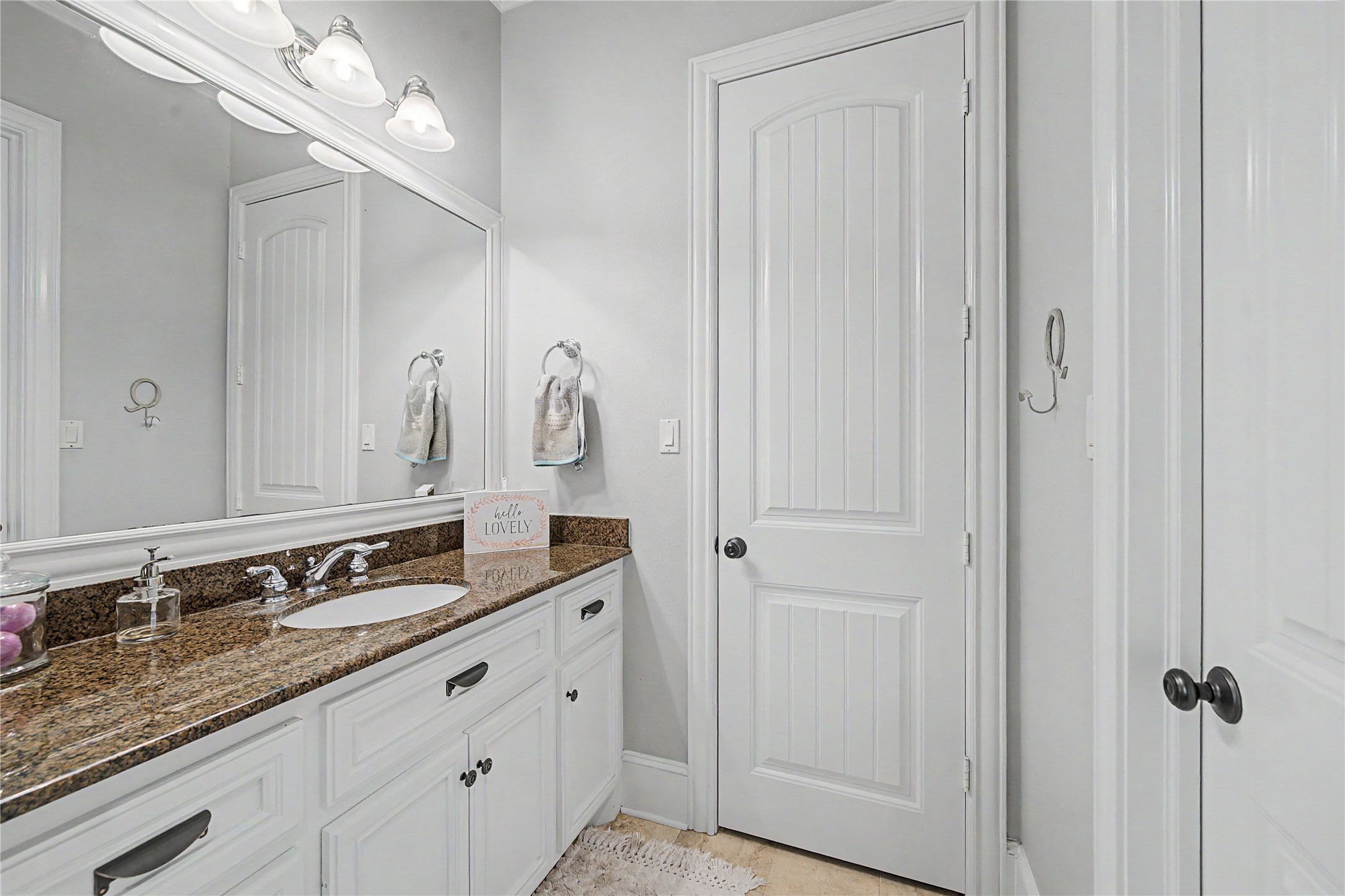 4423 Silver Jade Drive Spring, TX 77386 - Photo 23 of 45 a bathroom with a double vanity sink and a mirror