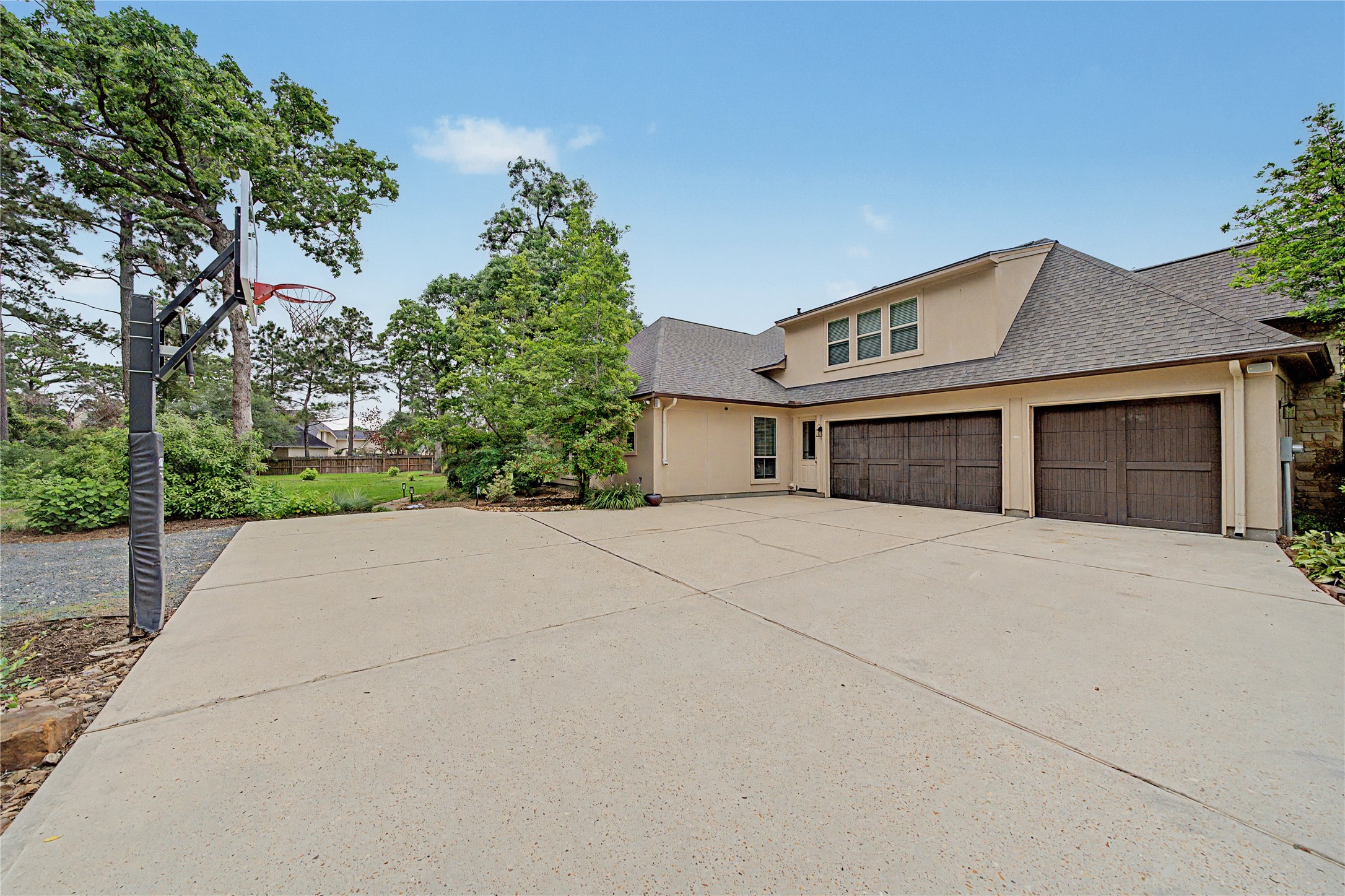 4423 Silver Jade Drive Spring, TX 77386 - Photo 39 of 45 a front view of a house with a yard and garage