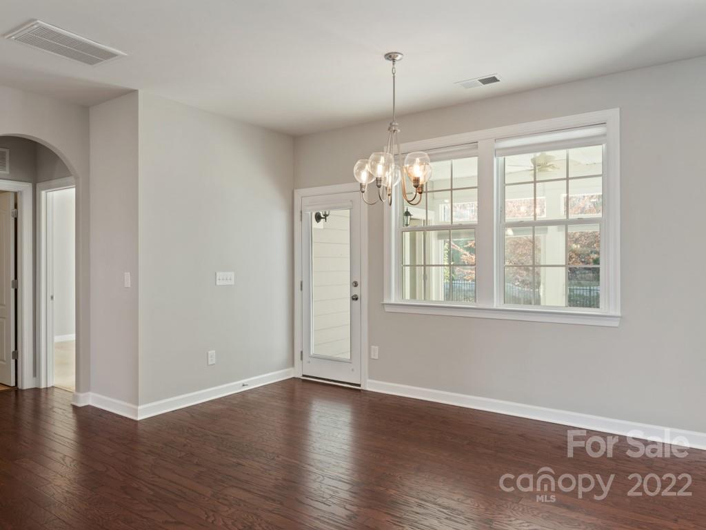 1335 Bryson Gap Drive Fort Mill, SC 29715 - Photo 16 of 29 an empty room with wooden floor and windows